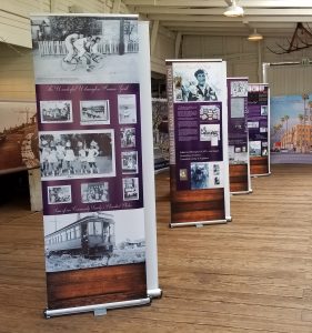 Retractable banner displaying high-definition printed graphics on a sturdy base.