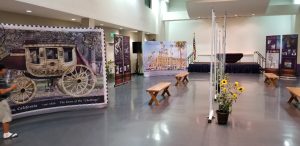 Portable art display setup using museum-style stands.