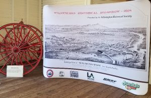 Portable tension fabric exhibition stand with smooth graphic and lightweight frame.