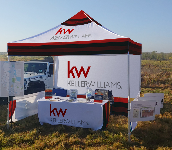 Custom pop-up tent at an outdoor event, showcasing brand presence.