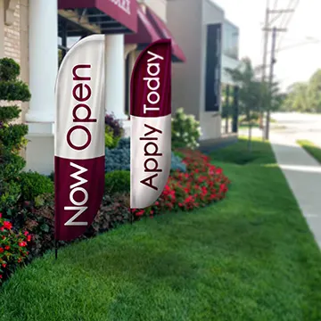 Durable custom feather flags suitable for wind and indoor display.