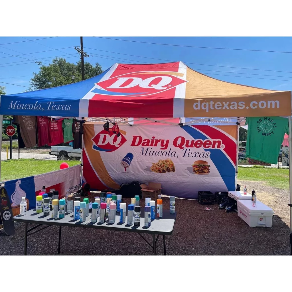 10x15 custom display setup showcasing branded customer signage at an event.