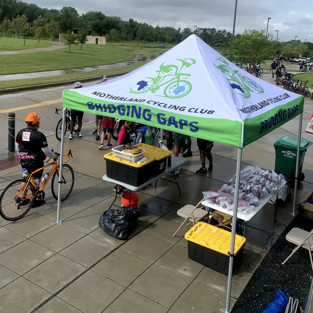 Outdoor display tent branded with Urban Alchemy logo.