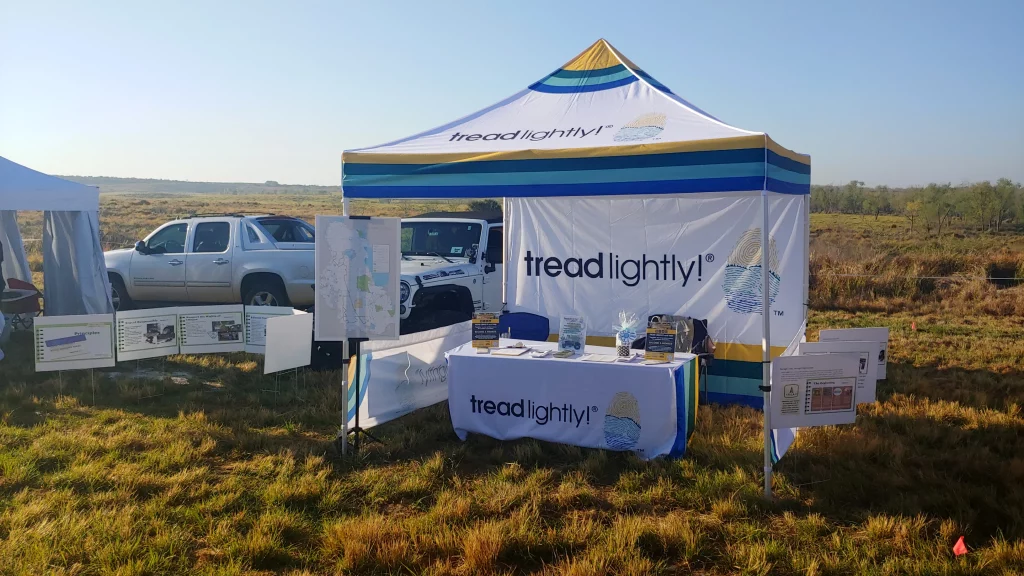 10x10 Tread Lightly canopy tent featuring branded graphics and outdoor event setup.