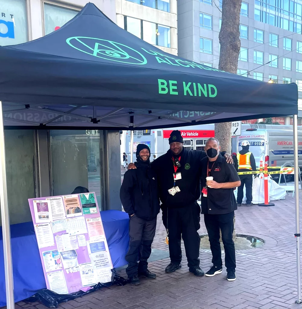 Urban Alchemy branded canopy tent displayed at an outdoor event.