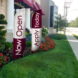 Feather banners displayed in high-traffic areas to attract customers and promote events.