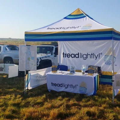10x10 Tread Lightly canopy tent featuring branded graphics and outdoor event setup.